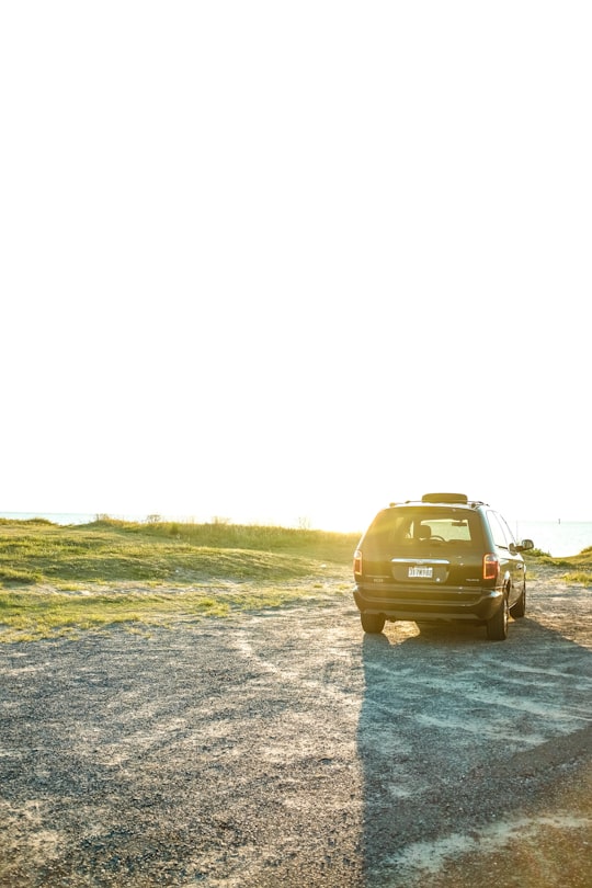 brown suv on gray asphalt road during daytime in Deal Island United States