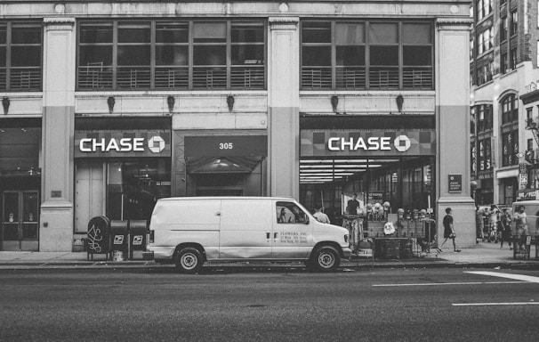 white van parked beside building