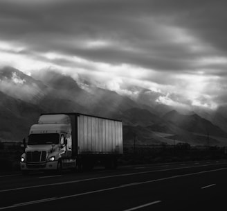 white trailer truck on road