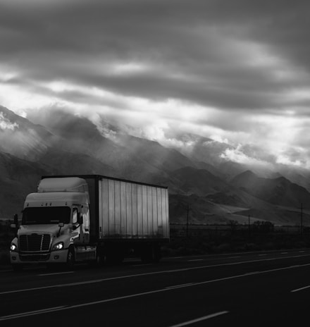 white trailer truck on road