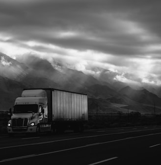 white trailer truck on road