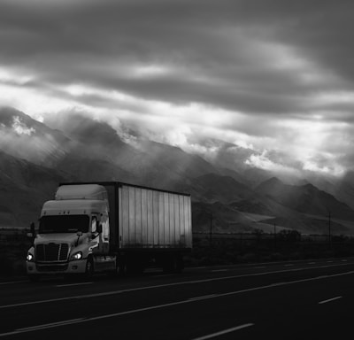 white trailer truck on road