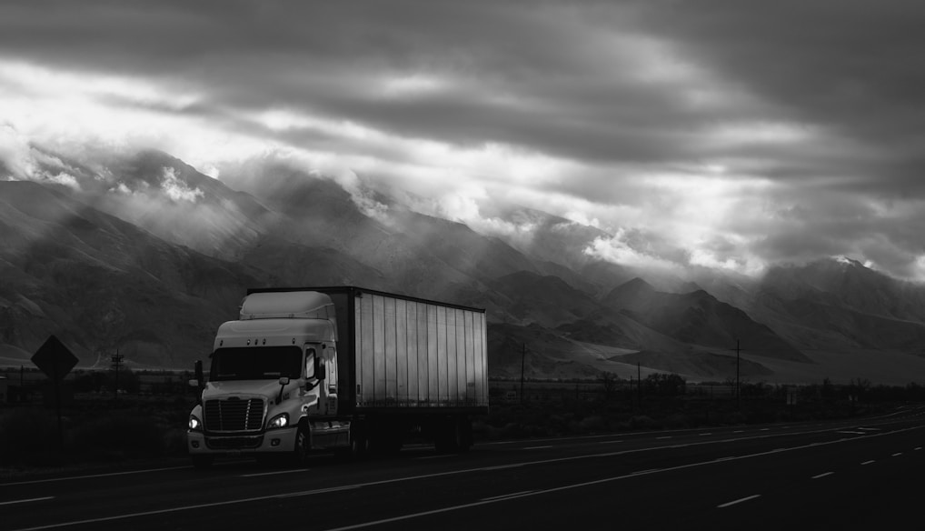 white trailer truck on road