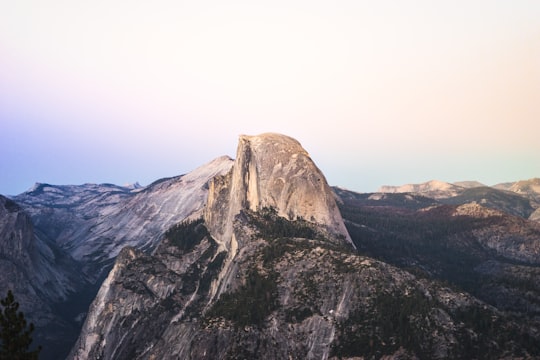 gray and brown rock formation under blue sky photography in Yosemite National Park, Half Dome United States