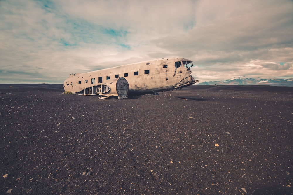 white bus on gray sand