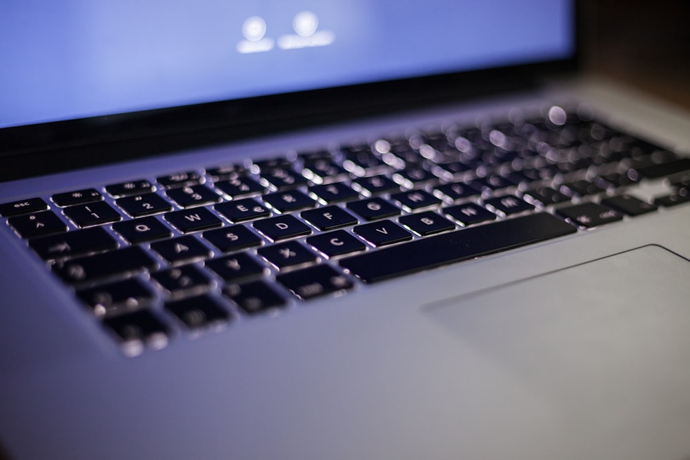 Close-up of a backlit laptop keyboard