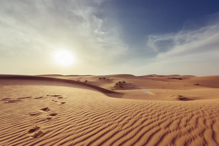 Desert dunes glowing at sunset