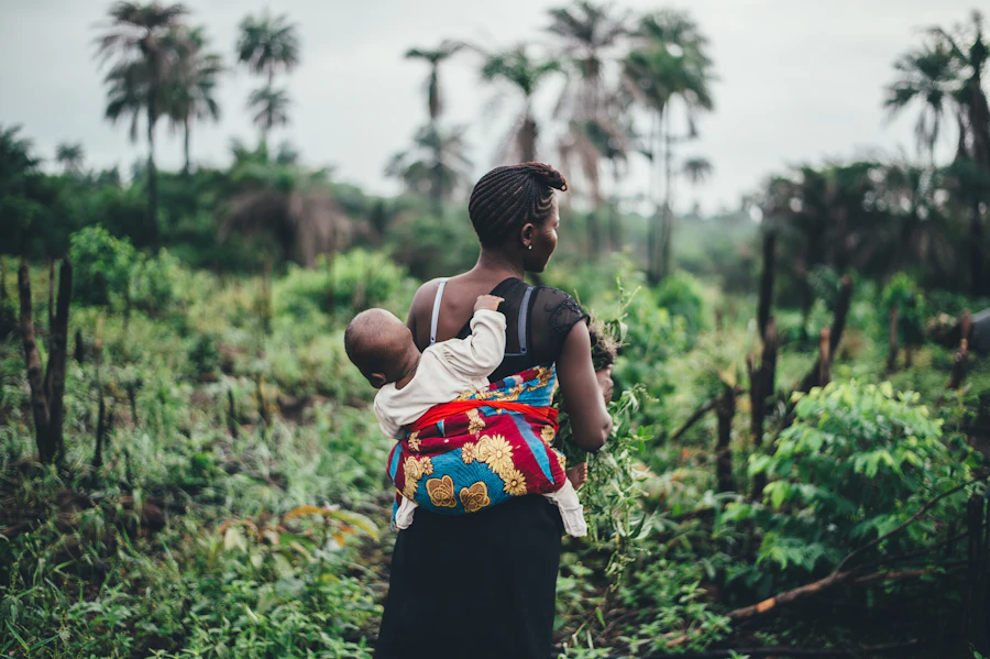 A mother carrying her baby in Uganda