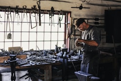man inside tool shed