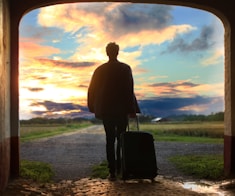 man holding luggage photo