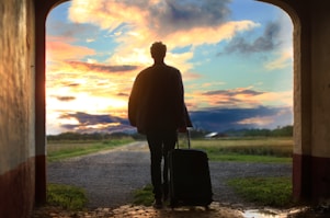 man holding luggage photo