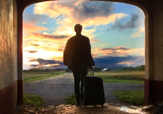 man holding luggage photo