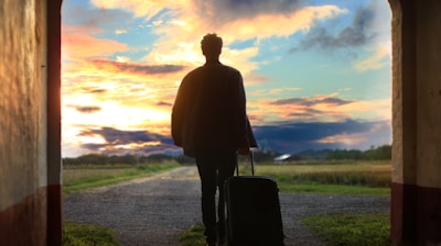 man holding luggage photo