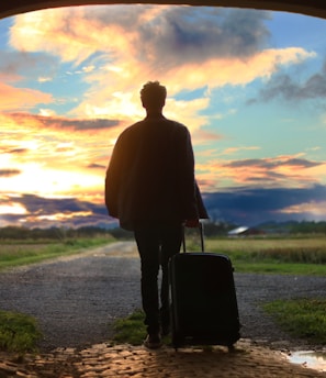 man holding luggage photo