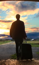 man holding luggage photo