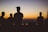 silhouette group of people under sunset