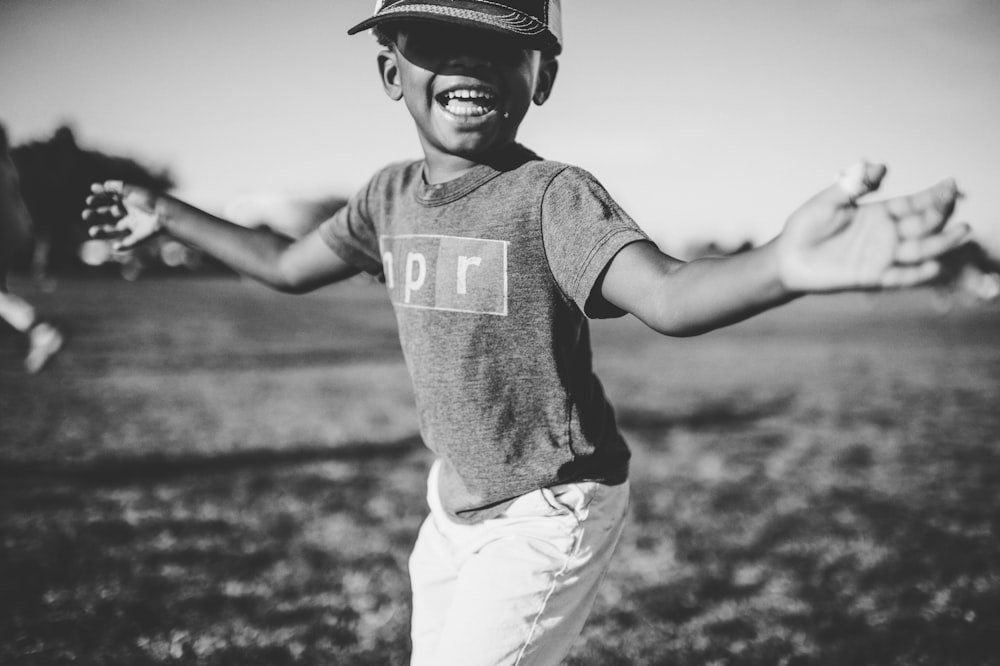 grayscale photo of boy