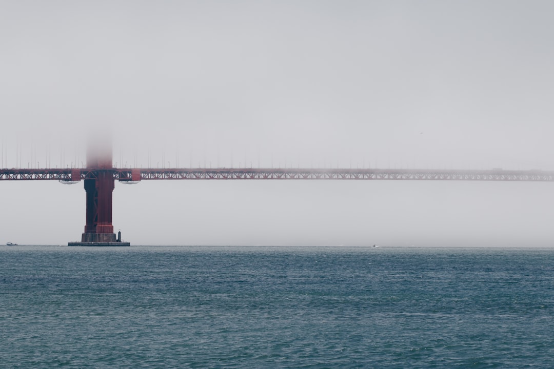 red bridge covered with fogs