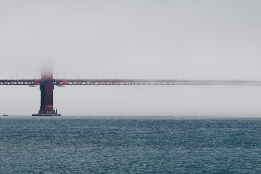 red bridge covered with fogs
