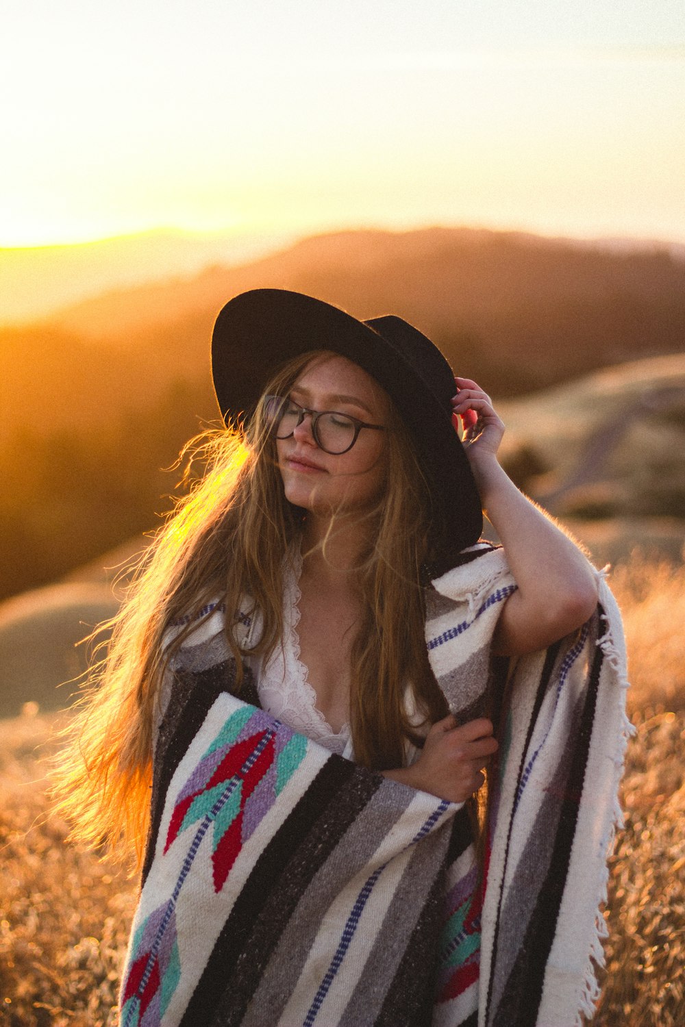 woman surrounded by plants during sunset