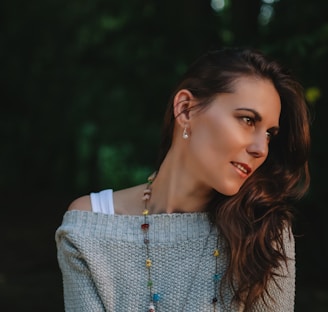 shallow focus photography of woman in gray sweater