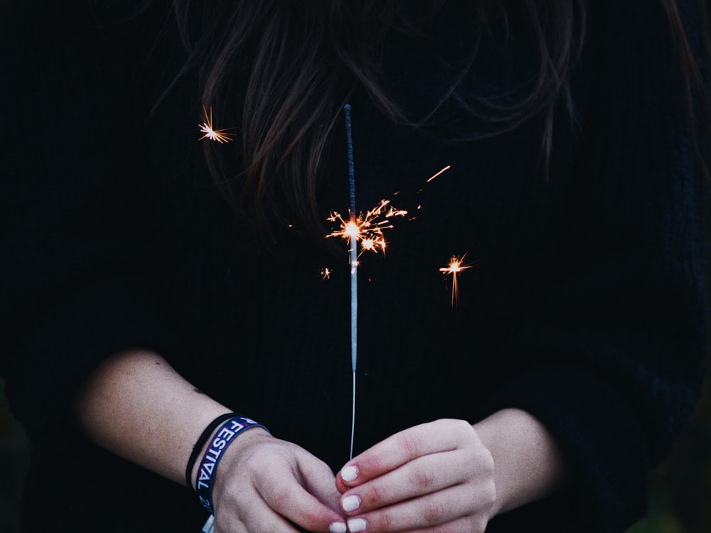 person holding firecracker