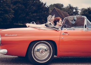 two person riding vintage coupe