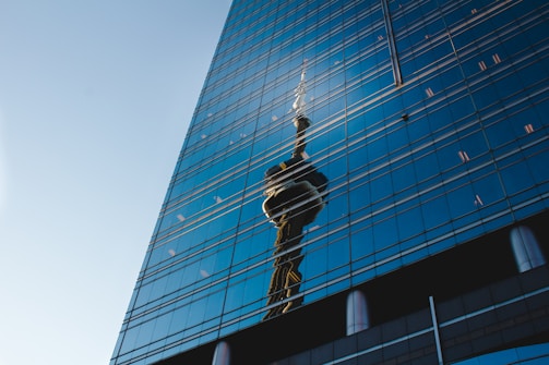 Close-up of the Skyline Tower’s glass facade reflecting the desert sun.