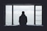 person looking out through window