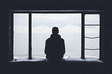 Person looking down with shadow