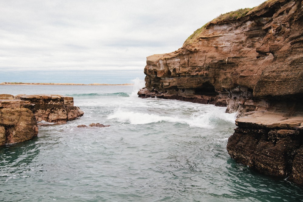 ocean under cloudy sky