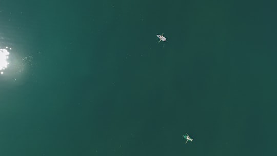 aerial photography of two boats on body of water in Königssee Germany