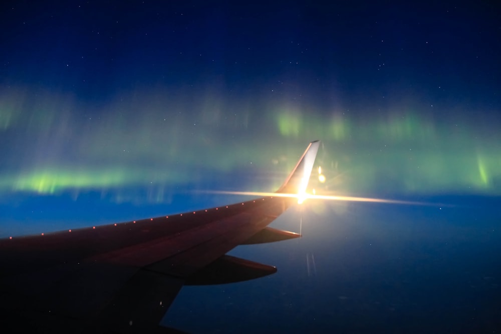 airplane wing under blue sky