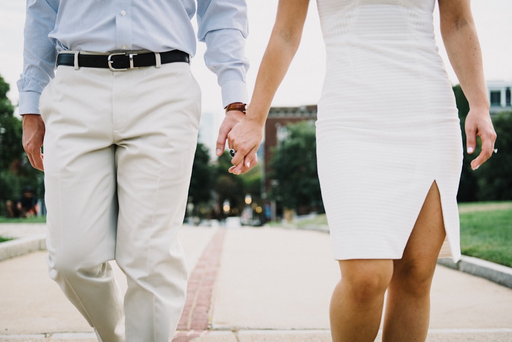 man and woman holding hands