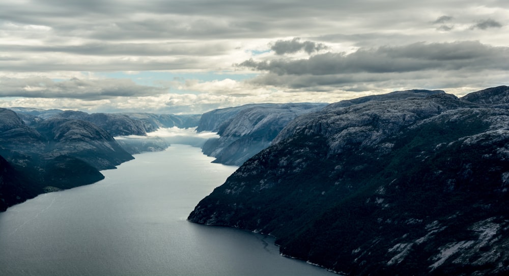 aerial view of mountains and body of water