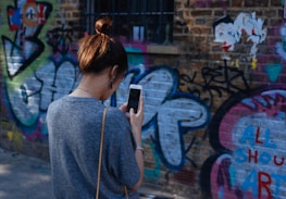 woman looking at smartphone