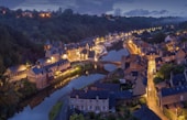aerial photography of lighted concrete buildings at night time