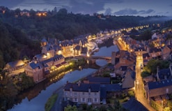 aerial photography of lighted concrete buildings at night time