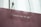 A maroon paper bag with a white rope handle features the quote 'youth has no age' printed in white lettering.