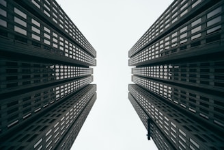 two gray high rise buildings