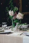 white and brown flowers on white table
