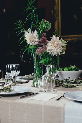 white and brown flowers on white table