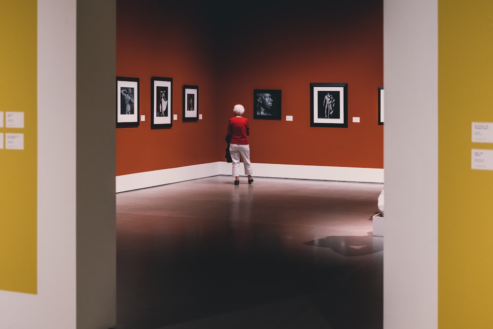photography of person standing in front of portrait