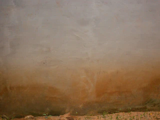 Matte decorative wall finish with earthy tones in a cozy home setting.