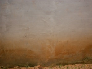 A textured wall with earthy tones reflecting cultural heritage