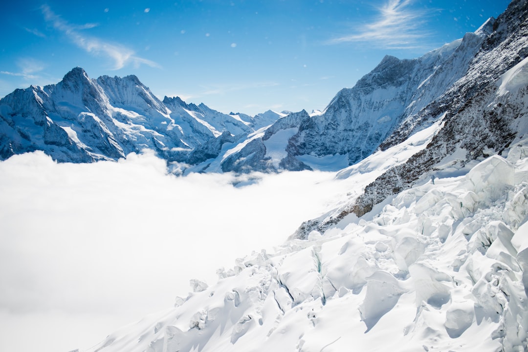 landscape photo of white mountains, Snowy plain bright blue sky
