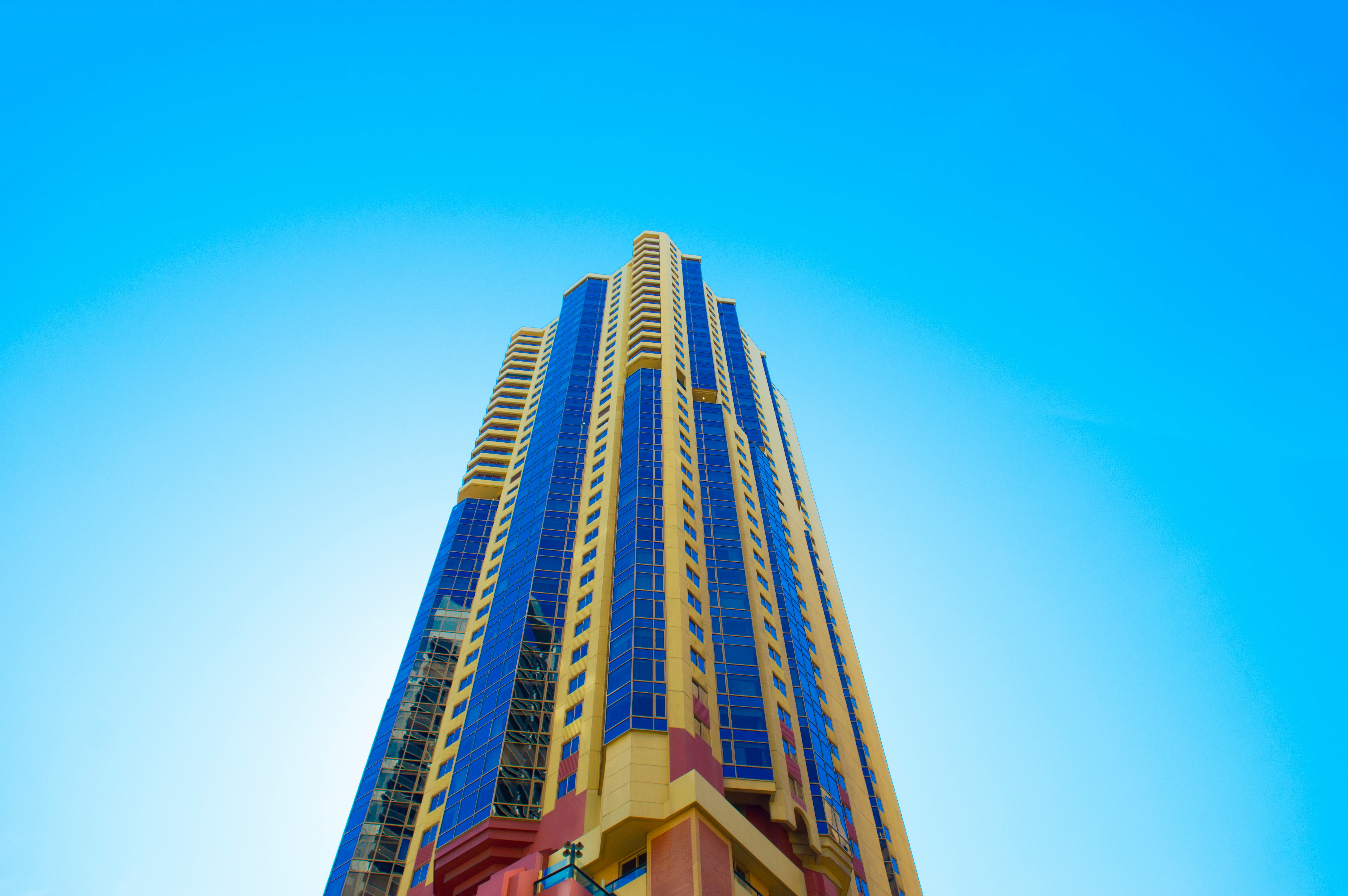 blue and beige high-rise building