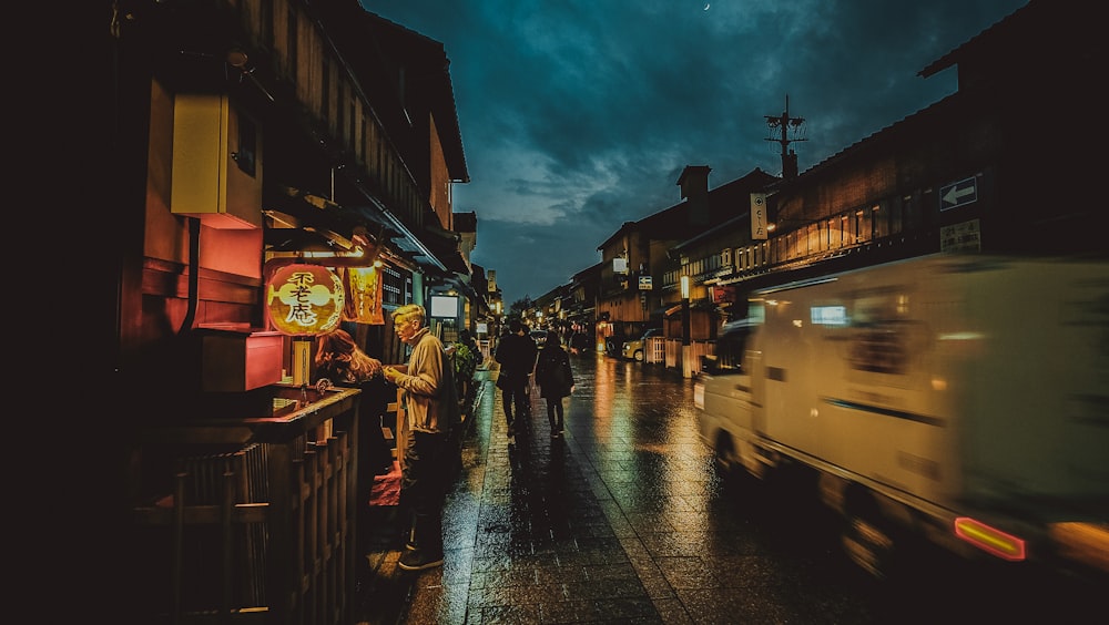 people walking on sidewalk