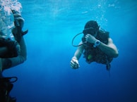 person scuba underwater