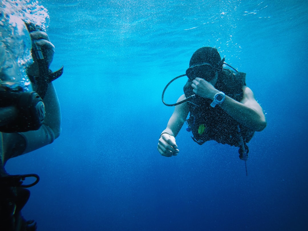 person scuba underwater